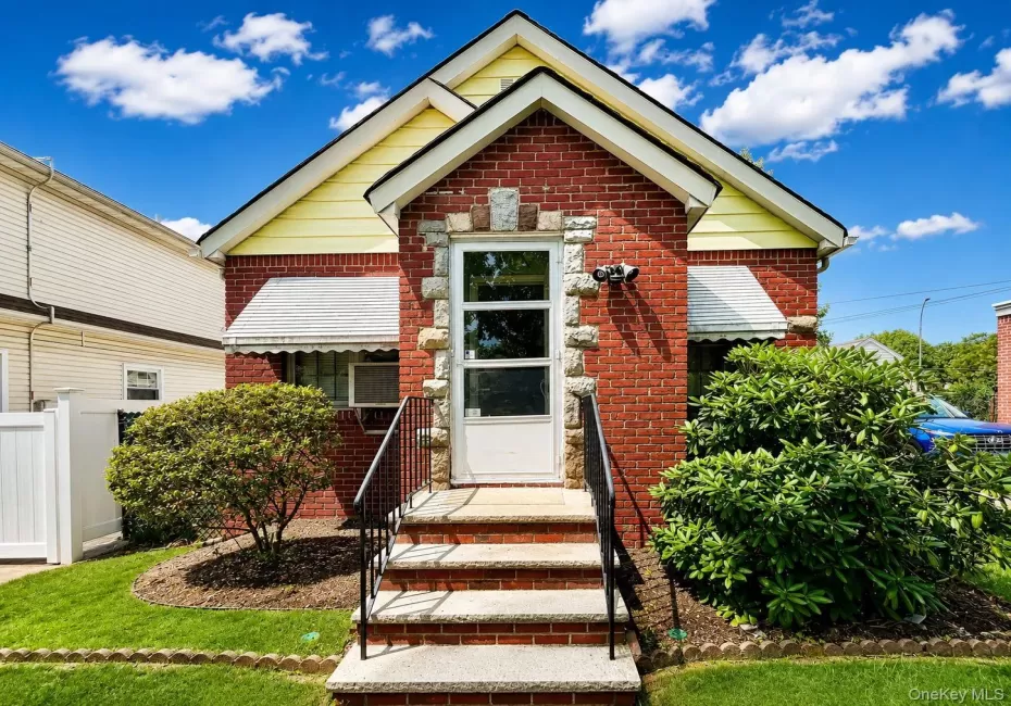 Brick-clad exterior with yellow siding accents Brick-clad exterior with yellow siding accents