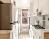 Fully renovated windowed kitchen with new shaker style cabinets, quartz counter tops and stainless steel appliances Fully renovated windowed kitchen with new shaker style cabinets, quartz counter tops and stainless steel appliances