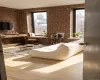 3 large windows, lots of light, staged for hanging out and watching tv. 3 large windows, lots of light, staged for hanging out and watching tv.