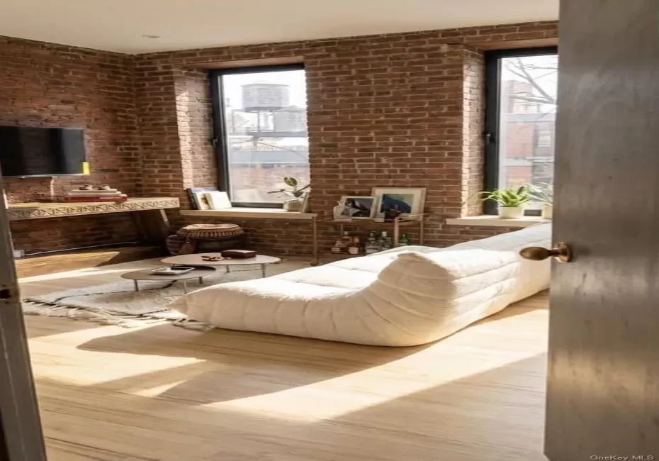 3 large windows, lots of light, staged for hanging out and watching tv. 3 large windows, lots of light, staged for hanging out and watching tv.