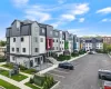 View of property with a residential view and uncovered parking View of property with a residential view and uncovered parking