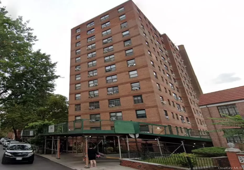 Brick facade multi-story building featuring multiple residential units Brick facade multi-story building featuring multiple residential units