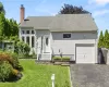 Exterior featuring light gray siding, a single-car garage Exterior featuring light gray siding, a single-car garage