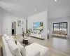 Spacious and open living area filled with natural sunlight from oversized windows, designed for both everyday comfort and entertaining. Spacious and open living area filled with natural sunlight from oversized windows, designed for both everyday comfort and entertaining.