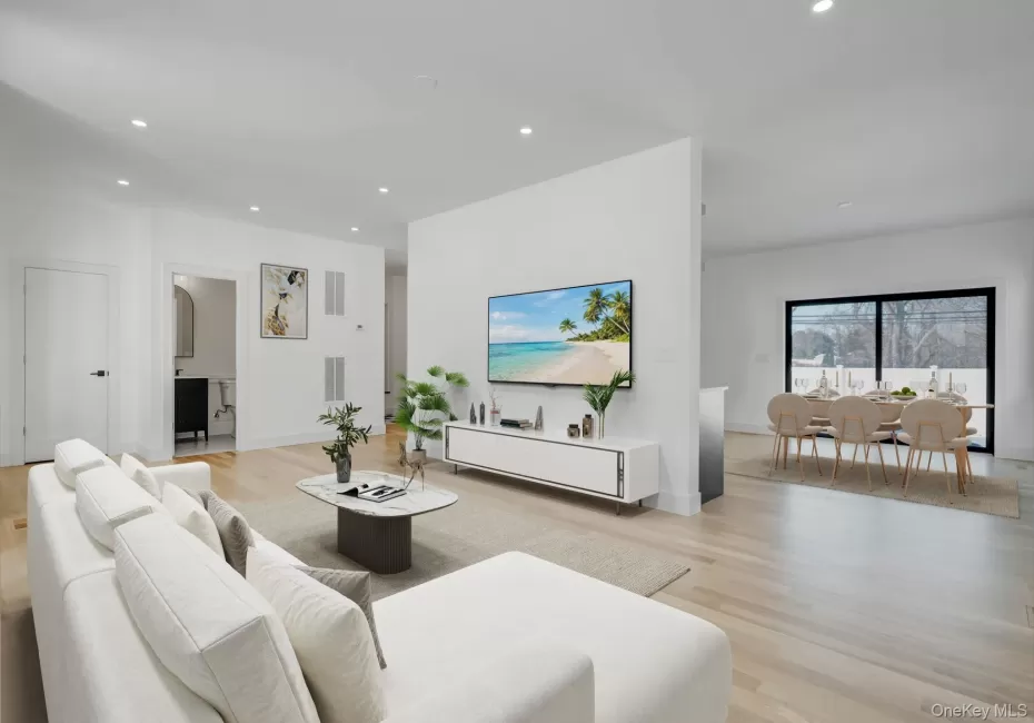Spacious and open living area filled with natural sunlight from oversized windows, designed for both everyday comfort and entertaining. Spacious and open living area filled with natural sunlight from oversized windows, designed for both everyday comfort and entertaining.